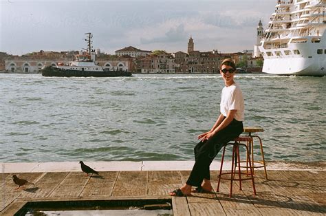 A Beautiful Woman Sitting In Venice Del Colaborador De Stocksy Anna Malgina Stocksy