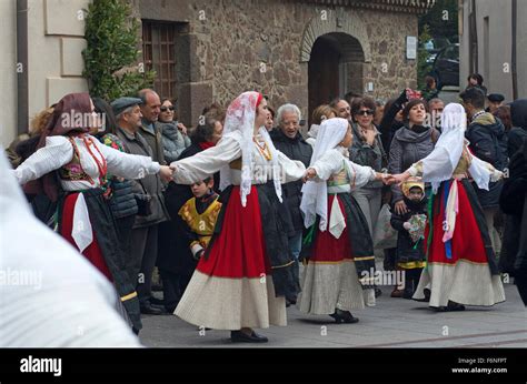 Sardinian People In Traditional Clothes During A Dance In Carnival