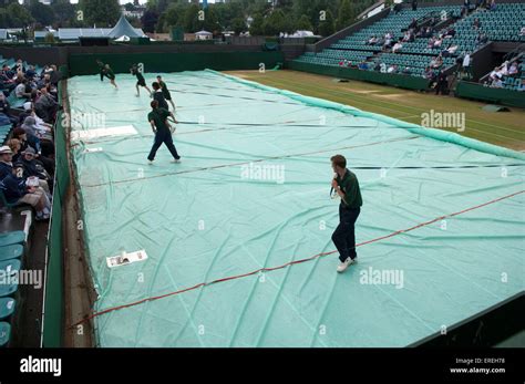 Removing The Rain Covers At Wimbledon Tennis Championships London
