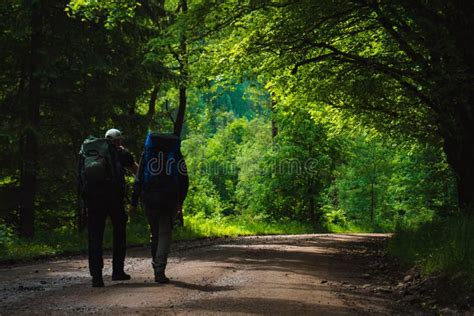 Two Friends Travel In Mountains With Backpacks Stock Photo Image Of Road Lifestyle 155655936