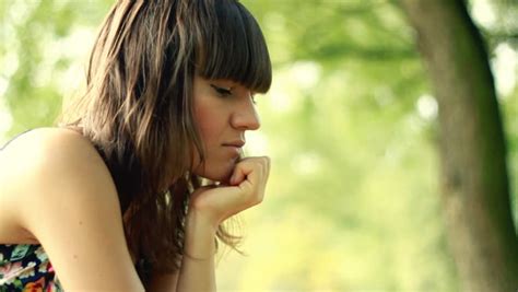 Young Sad Lonely Beautiful Woman Face In The Park Stock Footage Video