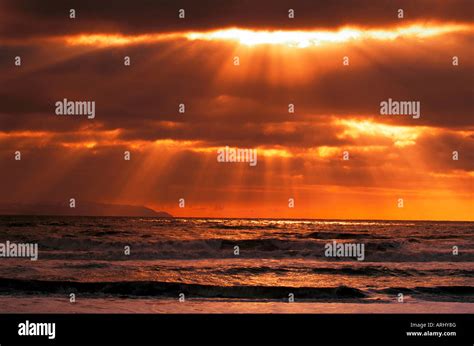 Sun Rays Over The Ocean At Sunset Stock Photo Alamy