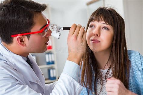 The Doctor Examining Patients Eye In Hospital Stock Photo Image Of