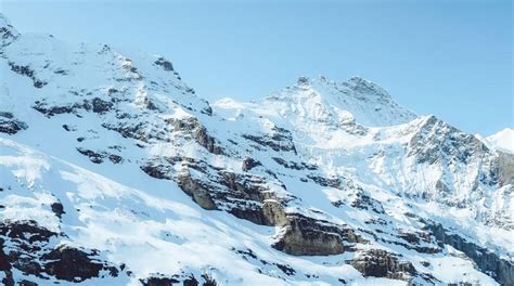 Mesmerizing Shot Of Highlands With Rugged Mountains Covered By Snow On