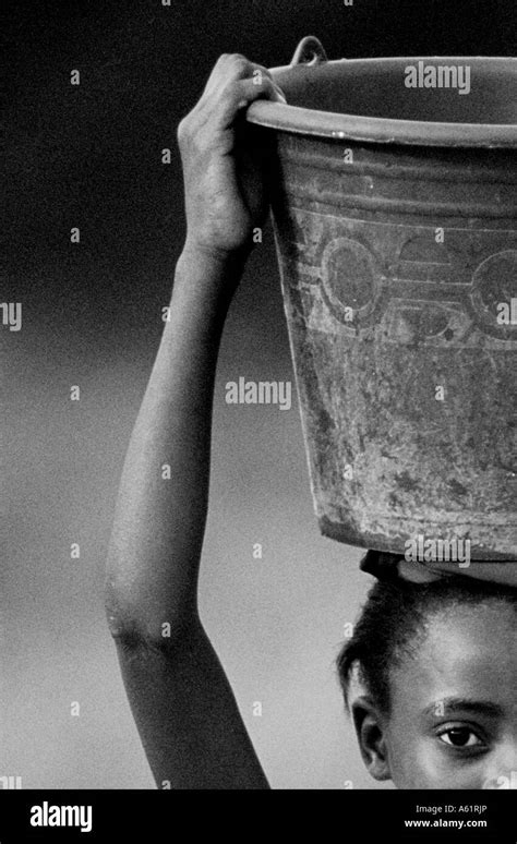 Woman Carrying Bucket On Head Black And White Stock Photos And Images Alamy