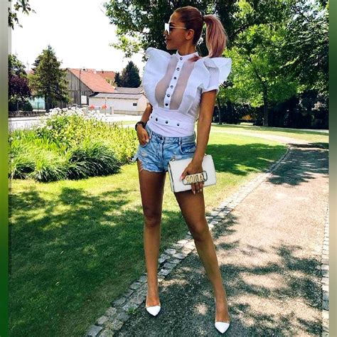 white top with blue denim shorts summer looks 2023 fashion canons