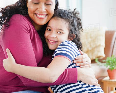 Mother And Daughter Hugging Stock Photo Dissolve