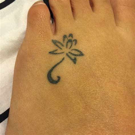 Foot Tattoo Of A Lotus Flower On Thelma