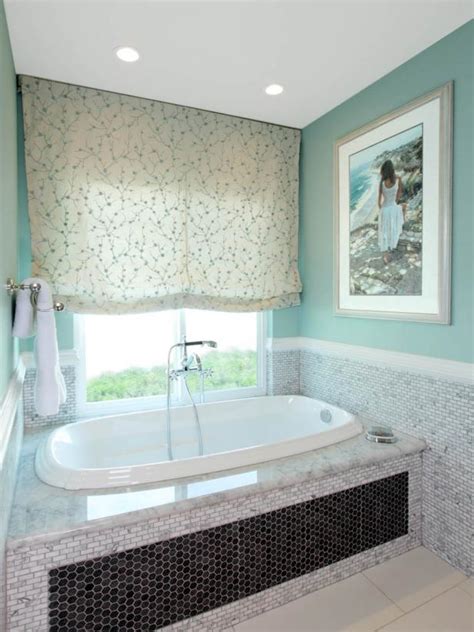 Like this, but with a subway tile back matching rest of shower, marble sides and top, and probably two marble shelves. Teal Master Bathroom with Soak Tub | HGTV