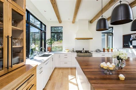 Wood Accent Details In Bright Contemporary Kitchen With Large Island