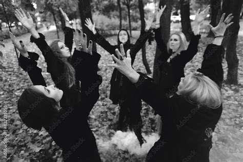 Coven Of Witches A Group Of Friends As Witches On Halloween Perform A