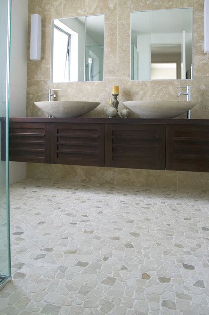 Bathroom tile flooring presents the greatest range of tile size possibilities, from mosaic on up to large format tile. Island Stone random pebble floor - Contemporary - Wall And ...