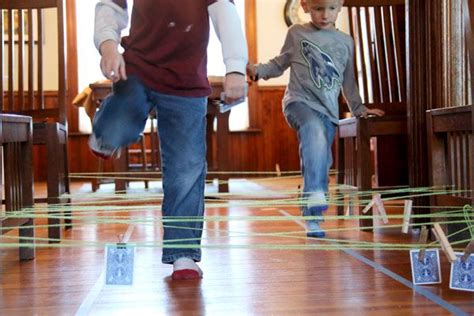 A String Obstacle Course To Get Kids Moving And Learning About Numbers
