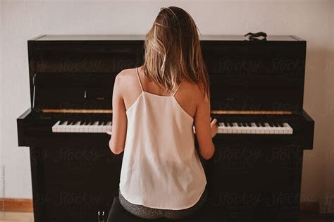 From The Back View Of A Woman Playing Piano By Stocksy Contributor Amor Burakova Playing