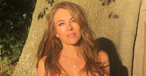 Liz Hurley Strips Down To Tiny Bikini And Barely There Shorts As She