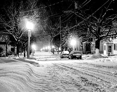 Illuminated Street Light On Snow Covered City · Free Stock Photo