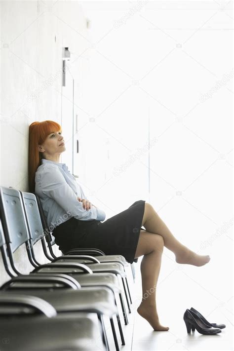 Businesswoman Sitting With Legs Crossed — Stock Photo © Londondeposit