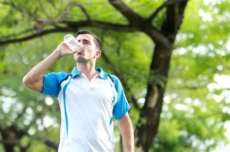Young Sporty Man Drinking Mineral Water Stock Photo Image Of Break