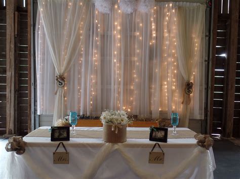 This Lighted Curtain Backdrop Is A Great Place To Seat The Bridal Party
