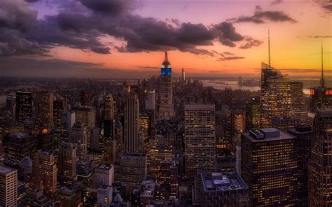 An Aerial View Of New York City At Sunset With The Empire Building In