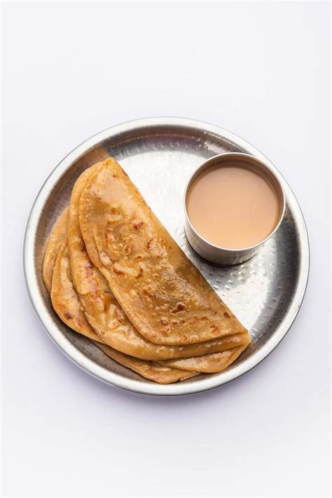 Chai Paratha Hot Tea Served With Flatbread Is A Traditional Simple