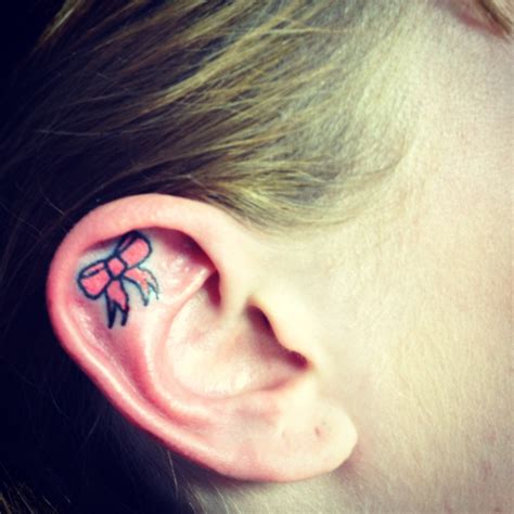 The symbol of the cross is timeless and dates all the way back to the 5th century. Pink ear bow tattoo | Tattoos | Pinterest | Bow tattoos ...