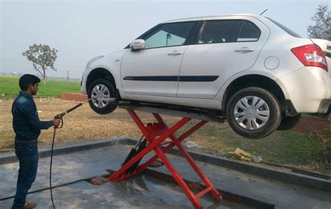 mild steel car washing scissor lift for servicing 2 4 tons at rs 98000 in new delhi