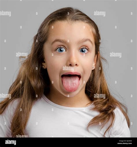 Portrait Of A Little Girl With Her Tongue Out Stock Photo Alamy