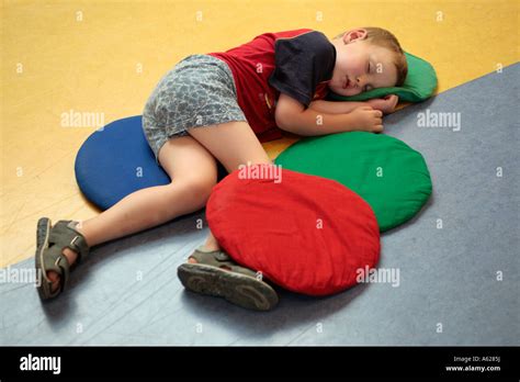 Portrait Of A Little Boy Sleeping On The Floor Stock Photo Alamy