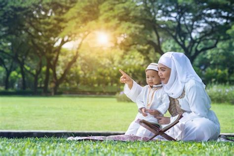 Asian Muslim Mother And Her Son Enjoying Quality Time At Park Muslim Mom And Son Concept Photo