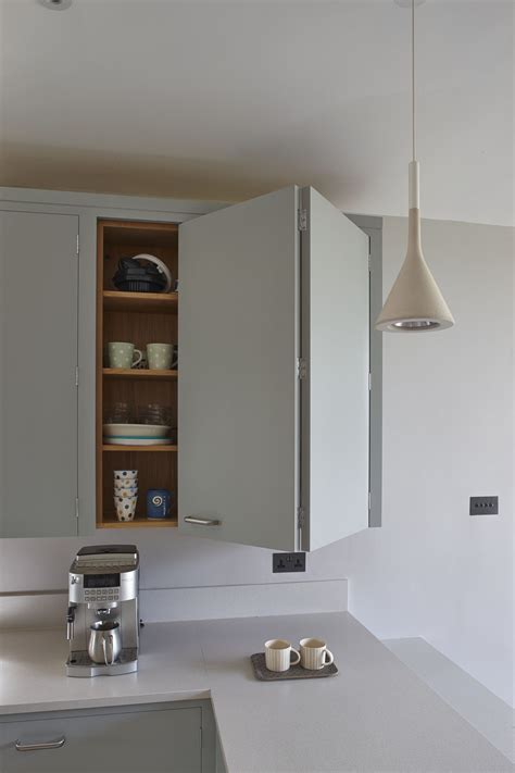 Minimalist Bi Fold Contemporary Kitchen Cupboard With Coffee Maker And