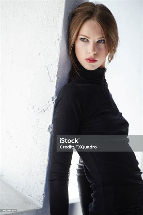 Portrait Of Brunette Slim Woman In Black Clothing Stock Photo