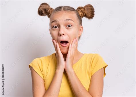 Portrait Of Surprised Teen Girl On Gray Background Funny Child