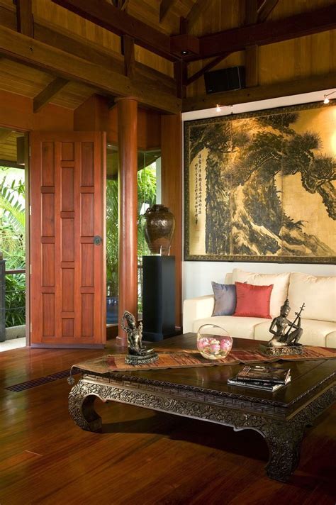 An Asian Style Living Room With A Tall Stained Wood Ceiling And Wood
