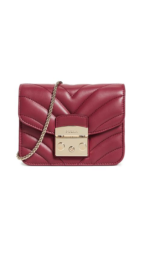 A soft container made out of paper or thin plastic, and open at the top, used to hold foods and…. Furla Leather Quilted Mini Metropolis Crossbody Bag - Lyst
