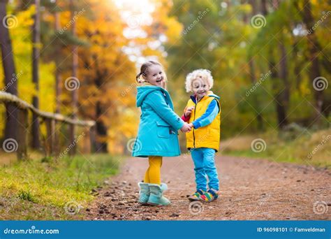 Kids Play In Autumn Park Children In Fall Stock Image Image Of