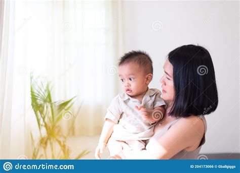Asian Mother Carrying Baby Cute Boy In Home Stock Photo Image Of
