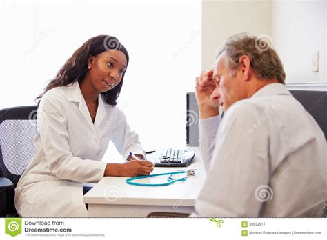 Female Doctor Treating Patient Suffering With Depression Stock Image