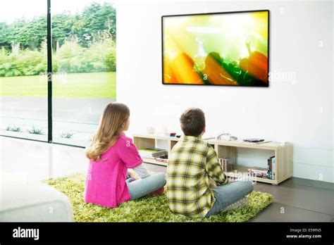 Children Watching Television In Living Room Stock Photo Alamy