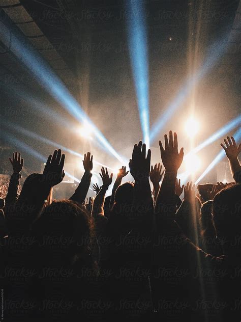 Hands Raised At Live Concert By Stocksy Contributor Branden Harvey