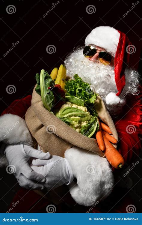 Santa Claus With A Bag Full Of Vegetables And Fruits Stock Photo