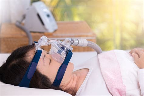 cnsac obstructive sleep apnea therapy woman wearing cpap mask cpap continuous positive airway