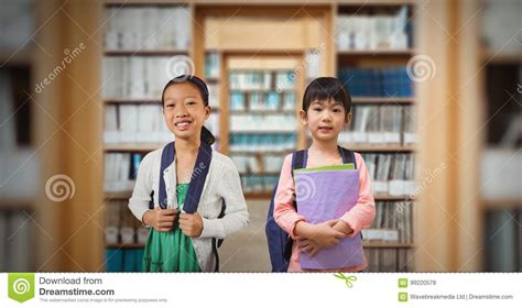 Two School Children In Library Stock Photo Image Of Backpack