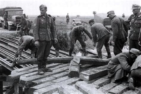 Men Of Wehrmacht Gebirgs Pioneer Erecting A Bridge