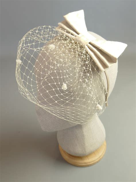 Silk Bow And 1950s Birdcage Veil