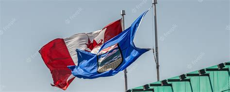 Premium Photo Canada Maple Leaf Flag And Alberta Provincial Flags