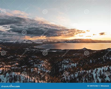 Aerial View Of The Beautiful Lake Tahoe Captured On A Snowy Sunset In