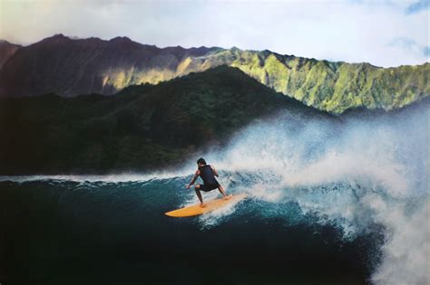 Man Riding Surf On Sea Near Mountain Hawaii Hd Wallpaper Wallpaper Flare