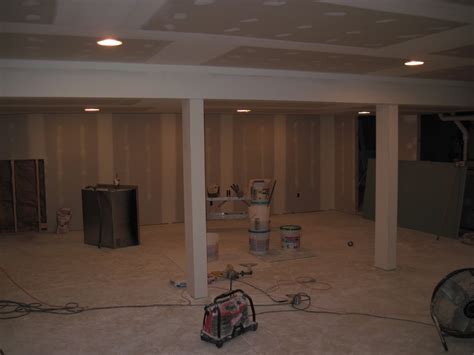 The easiest and most cost effective way is to simply laminate new 1/2 sheetrock directly onto the existing textured walls, asuming the texture depth is not too great. Basement drywall finishing with knockdown ceiling texture ...