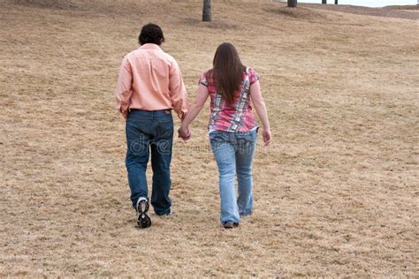Young Couple Walking Hand In Hand Stock Photos Image 13620693